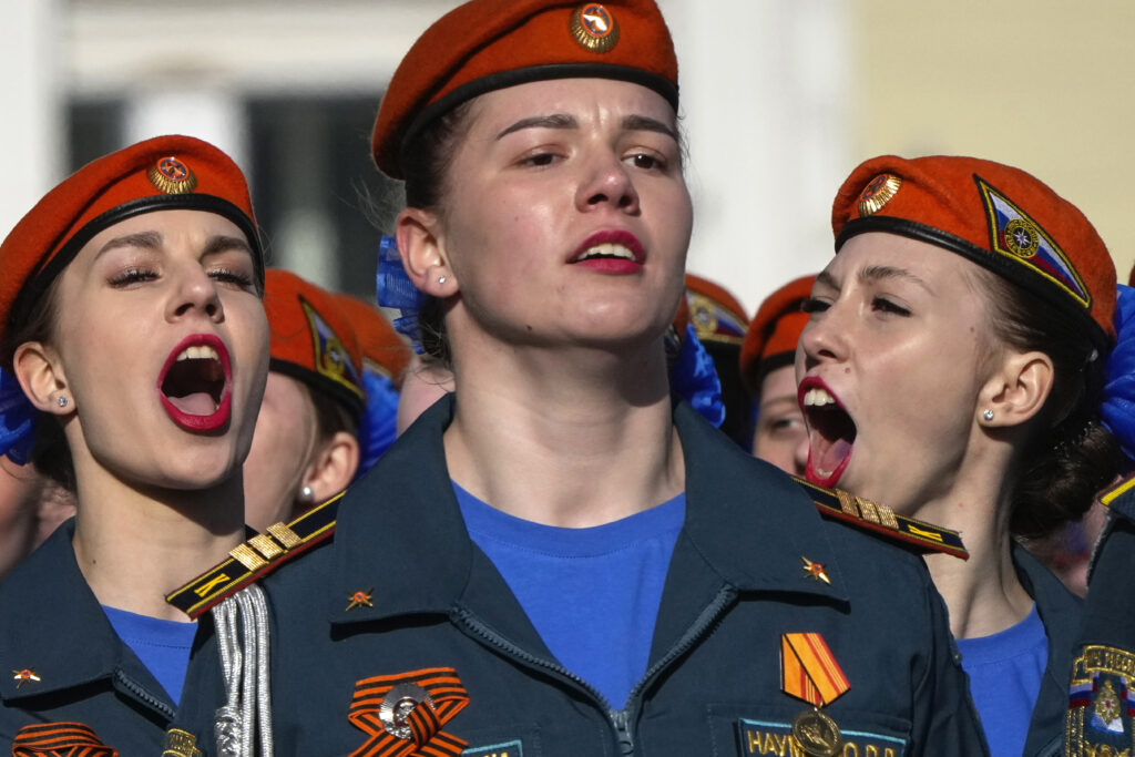 Russia's Emergency Situations Ministry female cadets shout as they march during a rehearsal in St. Petersburg, Russia, Tuesday, April 30, 2024 for the Victory Day military parade which will take place at Dvortsovaya (Palace) Square on May 9 to celebrate 79 years after the victory in World War II. (AP Photo/Dmitri Lovetsky)