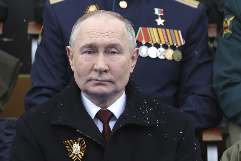 Russian President Vladimir Putin sits during the Victory Day military parade in Moscow, Russia, Thursday, May 9, 2024, marking the 79th anniversary of the end of World War II. (Mikhail Klimentyev, Sputnik, Kremlin Pool Photo via AP)