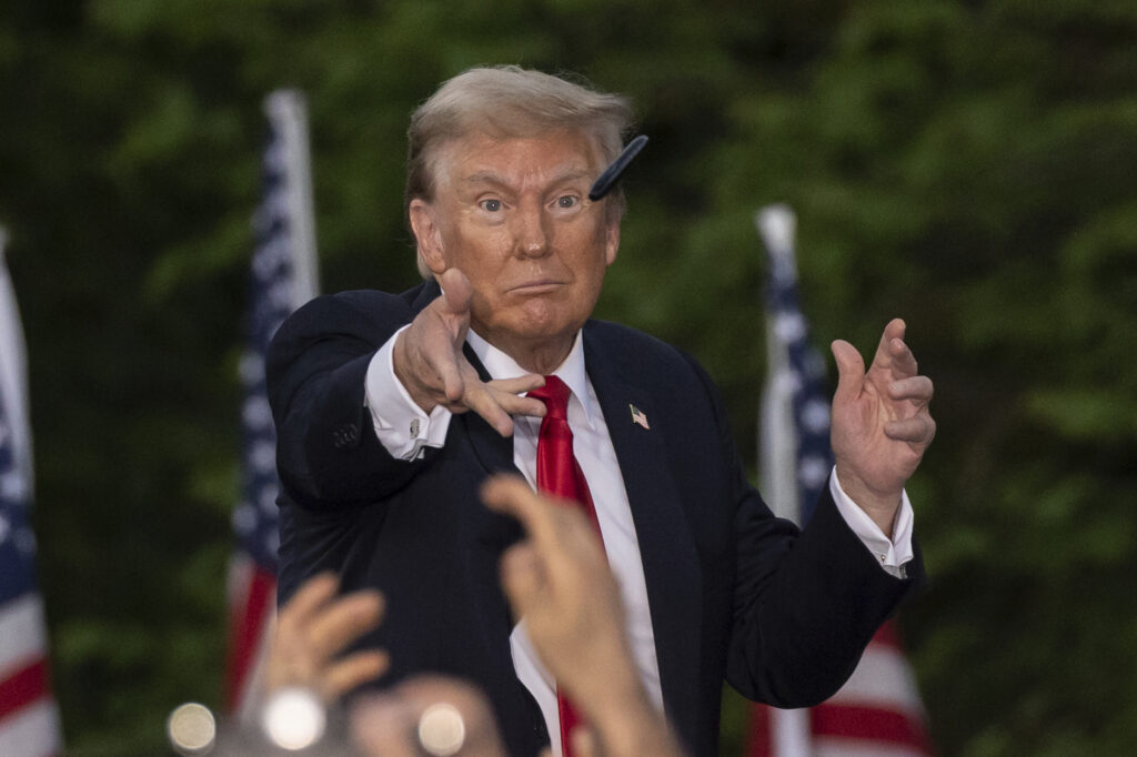 Republican presidential candidate former President Donald Trump throws a pen during a campaign rally in the south Bronx, Thursday, May. 23, 2024, in New York. (AP Photo/Yuki Iwamura)