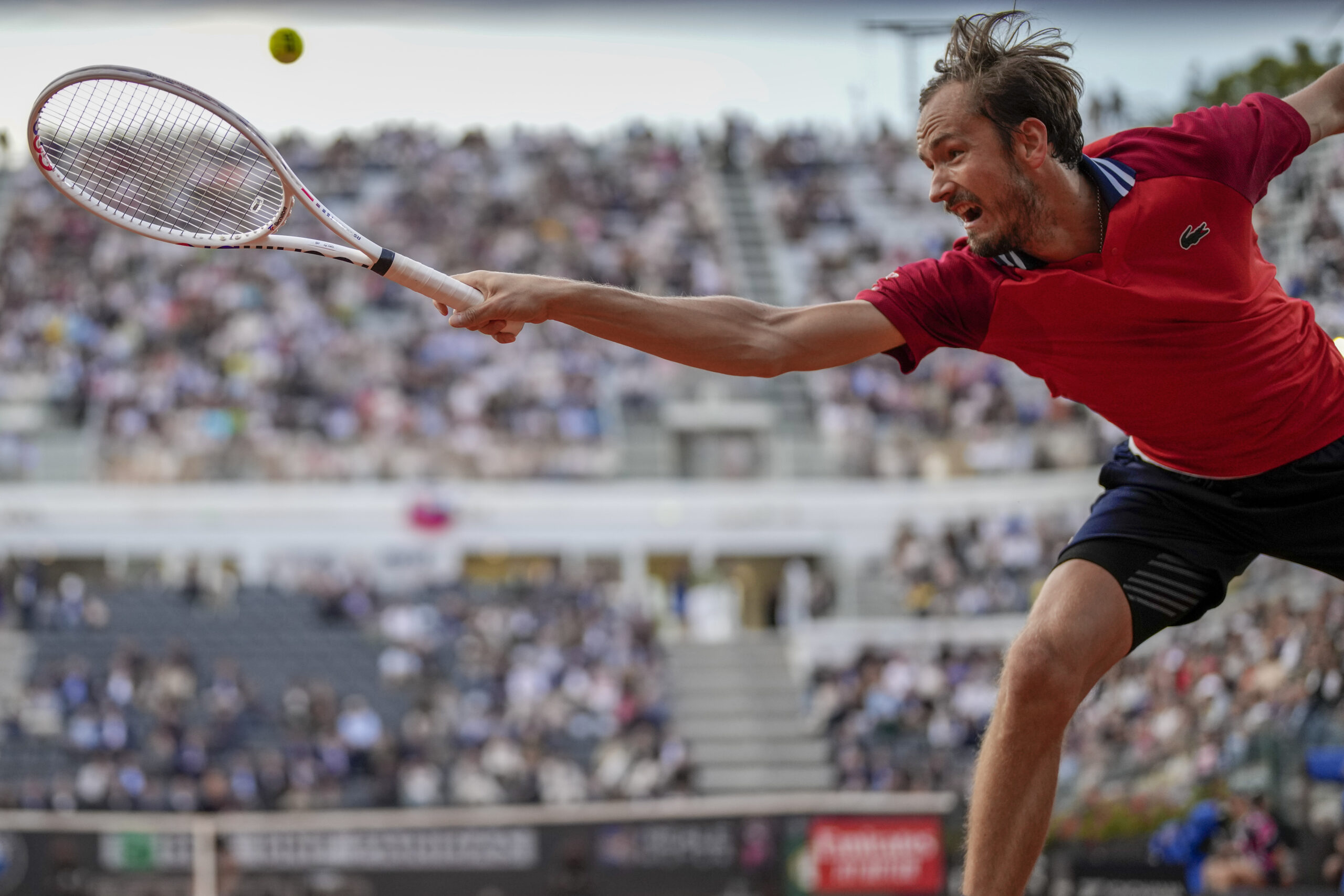 Russia's Daniil Medvedev returns the ball to Serbia's Hamad Medjedovic at the Italian Open tennis tournament, in Rome, Monday, May 13, 2024. (AP Photo/{photograper)
