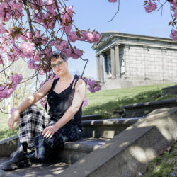 Writer-director Jane Schoenbrun poses for a portrait in Green-Wood Cemetery on Tuesday, April 23, 2024, with a mausoleum in the background. Photos by Christopher Smith/Invision/AP
