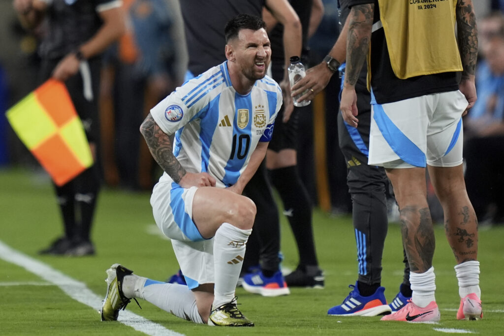 Argentina's Lionel Messi grimaces during a Copa America Group A soccer match against Chile in East Rutherford, N.J., Tuesday, June 25, 2024. (AP Photo/Julia Nikhinson)