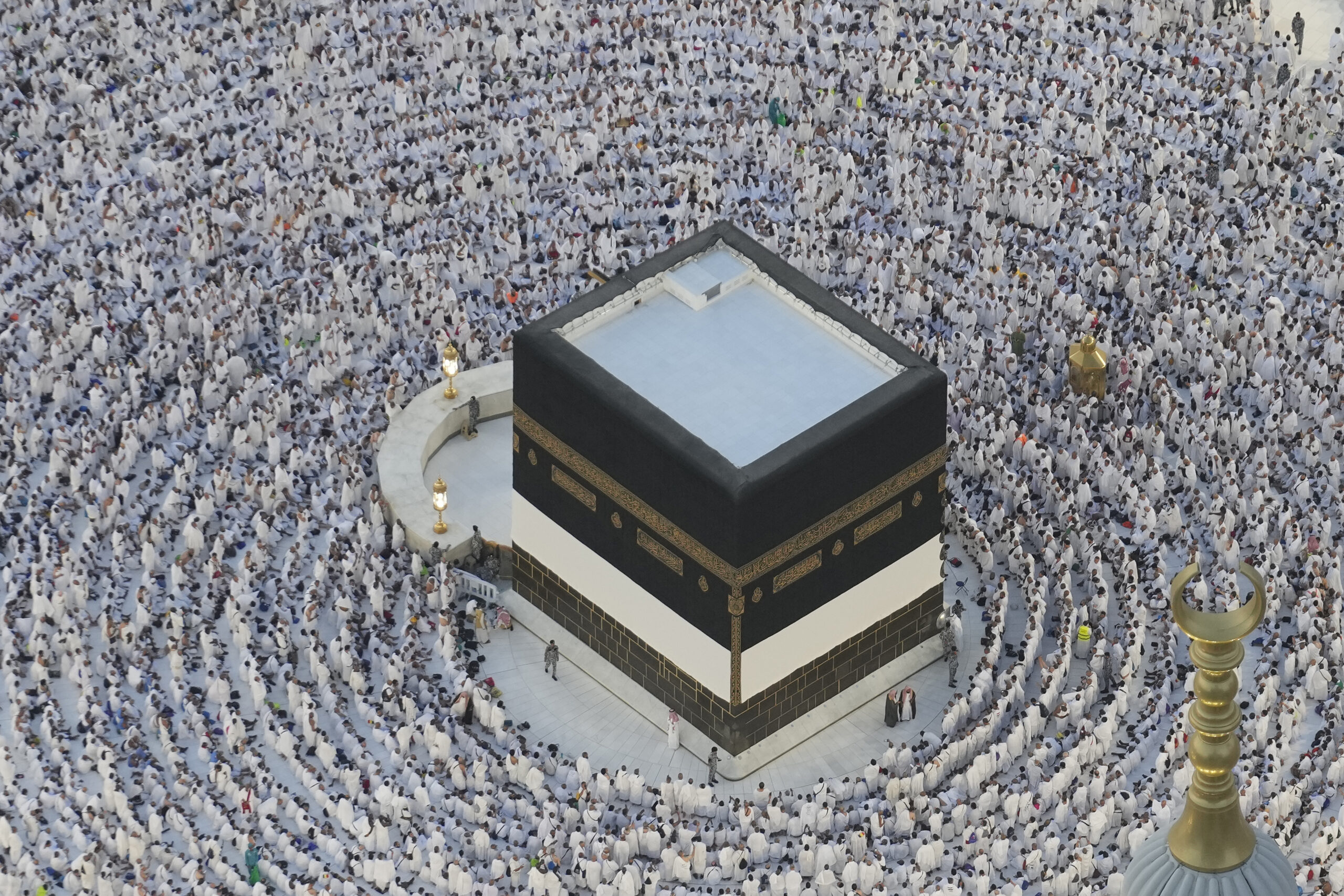 Muslim pilgrims circumambulate the Kaaba, the cubic building at the Grand Mosque, during the annual Hajj pilgrimage in Mecca, Saudi Arabia, Tuesday, June 11, 2024. (AP Photo/Rafiq Maqbool)