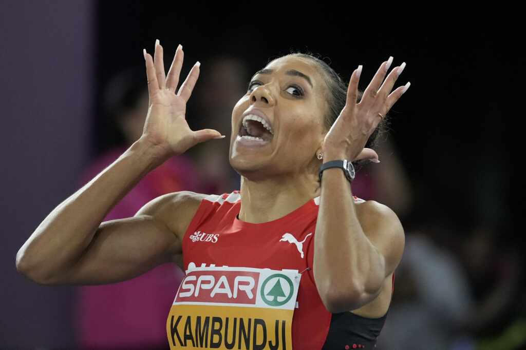 Mujinga Kambundji, of Switzerland, reacts after winning the gold medal in the women's 200 meters final at the European Athletics Championships in Rome, Tuesday, June 11, 2024. (AP Photo/Andrew Medichini)