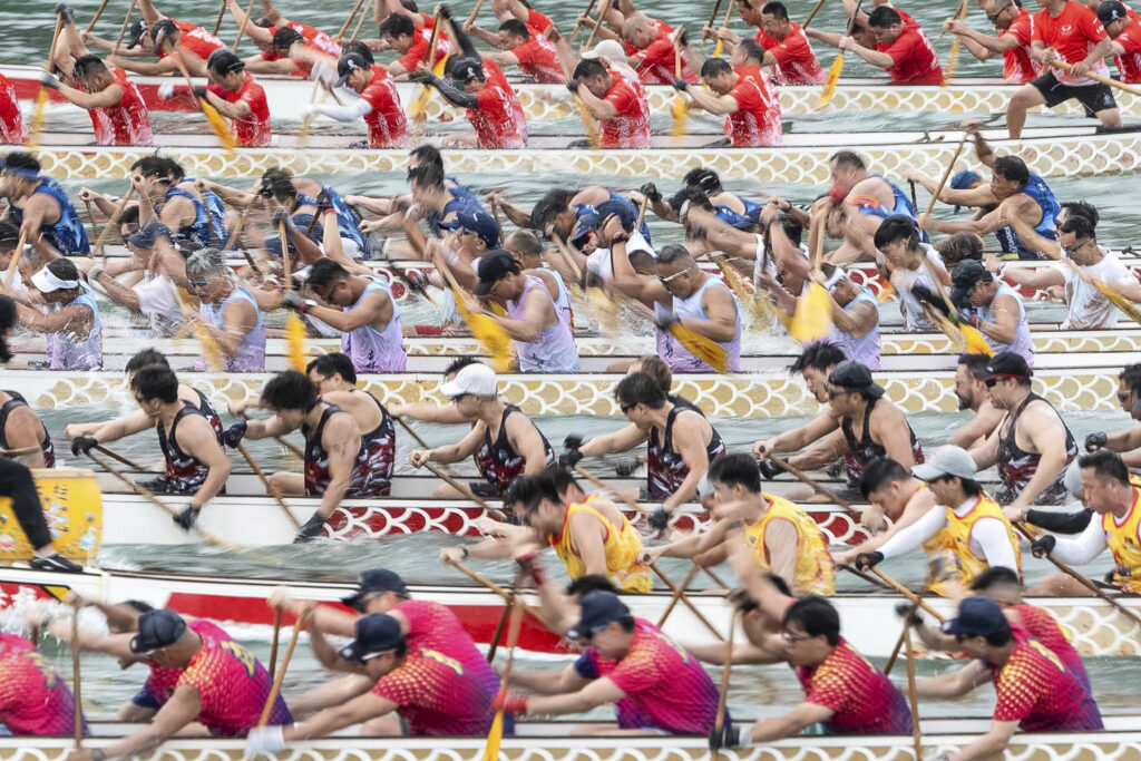 Competitors take part in the annual dragon boat race to celebrate the Tuen Ng festival in Hong Kong, Monday, June 10, 2024. (AP Photo/Chan Long Hei)