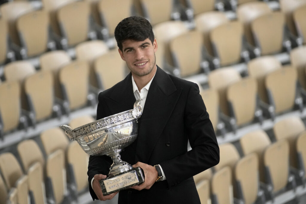Spain's Carlos Alcaraz holds the trophy as he poses for media after the French Open tennis tournament at the Roland Garros stadium in Paris, Monday, June 10, 2024. Alcaraz won the title on Sunday in the final against Germany's Alexander Zverev. (AP Photo/Christophe Ena)