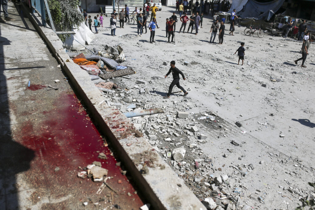 Blood can be seen in the aftermath of the Israeli strike on a U.N.-run school that killed dozens of Palestinians in the Nusseirat refugee camp in the Gaza Strip, Thursday, June 6, 2024. (AP Photo/Jehad Alshrafi)