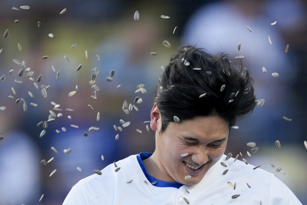 Los Angeles Dodgers designated hitter Shohei Ohtani celebrates his solo-home run during the first inning of a baseball game against the Texas Rangers, Wednesday, June 12, 2024, in Los Angeles. (AP Photo/Ryan Sun)