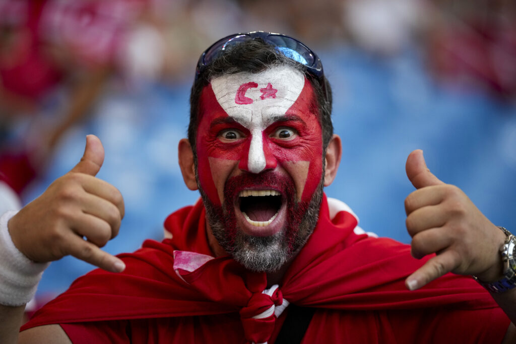 A Turkish supporter cheers outside the stadium ahead of a Group F match between Czech Republic and Turkey at the Euro 2024 soccer tournament in Hamburg, Germany, Wednesday, June 26, 2024.(AP Photo/Ebrahim Noroozi)