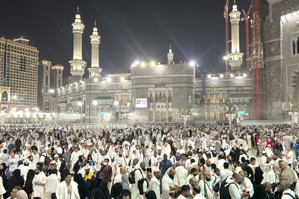 Pilgrims leave after offering prayers outside at the Grand Mosque during the annual Hajj pilgrimage in Mecca, Saudi Arabia, early Friday, June 14, 2024. Hajj is the annual Islamic pilgrimage to Mecca in Saudi Arabia that is required once in a lifetime of every Muslim who can afford it and is physically able to make it. Some Muslims make the journey more than once. (AP Photo/Rafiq Maqbool)