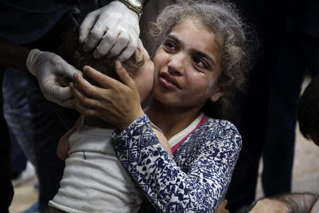 Palestinian children wounded in the Israeli bombardment on a residential building in Bureij refugee camp, are treated at al-Aqsa Martyrs hospital in Deir al-Balah, central Gaza Strip, late Tuesday, June 4, 2024. (AP Photo/Saher Alghorra)
