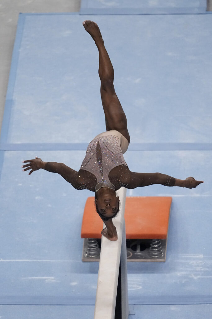 Simone Biles competes on the balance beam during the U.S. Gymnastics Championships, Sunday, June 2, 2024, in Fort Worth, Texas. (AP Photo/Tony Gutierrez)