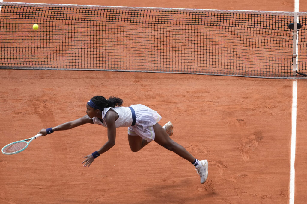 Coco Gauff of the U.S. plays a shot against Tunisia's Ons Jabeur during their quarterfinal match of the French Open tennis tournament at the Roland Garros stadium in Paris, Tuesday, June 4, 2024. (AP Photo/Thibault Camus)