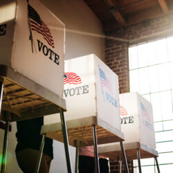 Voters at a polling booth. Photo: rawpixel.com/Adobe Stock