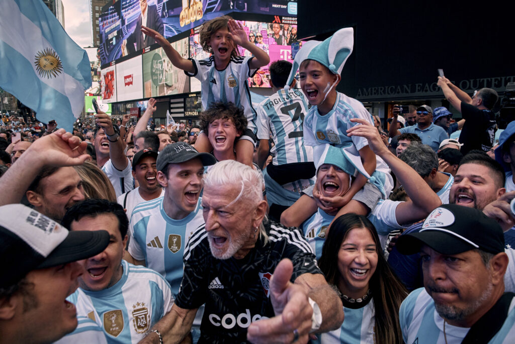 Argentina fans sing as they gather in Times Square to support the Argentina national soccer team Monday, June 24, 2024, in New York. Argentina is scheduled to face Chile, Tuesday in a Copa America soccer match. (AP Photo/Andres Kudacki)