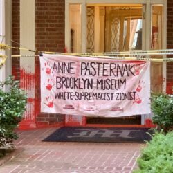 A co-op building in Brooklyn Heights was vandalized with red spray paint and a sign reading, “ANNE PASTERNAK BROOKLYN MUSEUM WHITE-SUPREMACIST ZIONIST.” Photo: Mary Frost, Brooklyn Eagle