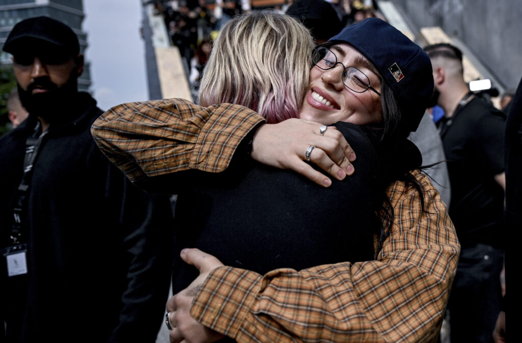 American singer Billie Eilish hugs a fan in Berlin Friday, June 7, 2024. The artist is on a promotional tour for her new album "Hit Me Hard and Soft." (Britta Pedersen/dpa via AP)
