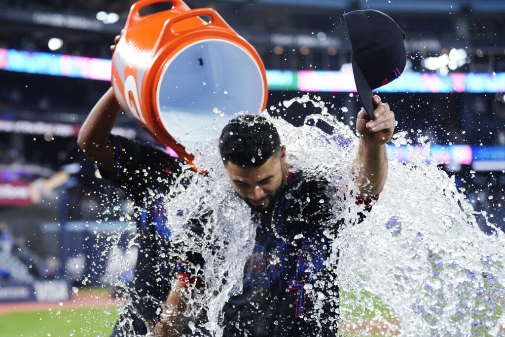 Toronto Blue Jays' Isiah Kiner-Falefa (7) is doused after the team's win over the Baltimore Orioles in a baseball game Wednesday, June 5, 2024, in Toronto. (Frank Gunn/The Canadian Press via AP)