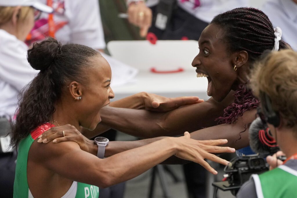 Fatoumata Binta Diallo, of Portugal, left, and Ayomide Folorunso, of Italy, react to the announcement of the official results after competing in a women's 400 meters hurdles semifinal at the European Athletics Championships in Rome, Monday, June 10, 2024. The two qualified for the final. (AP Photo/Gregorio Borgia)