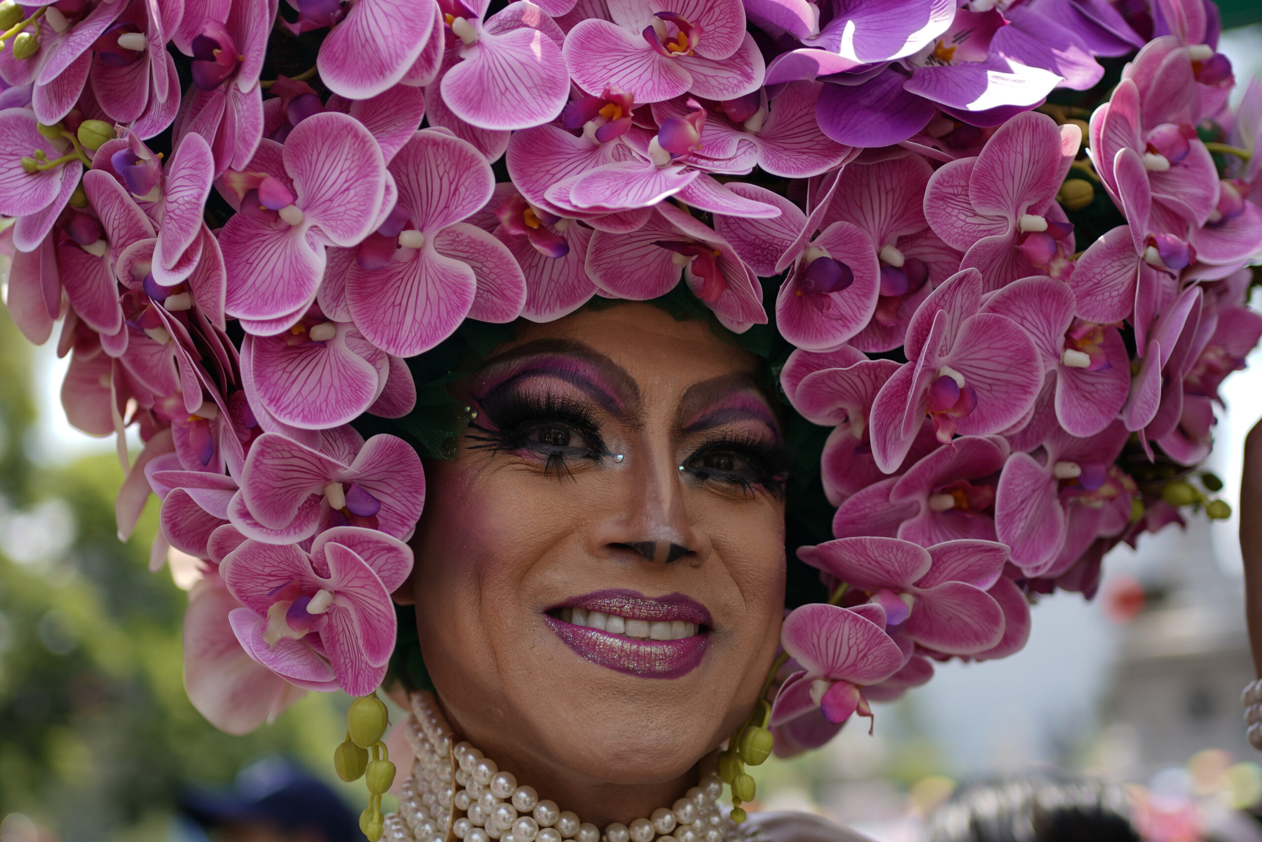 A participant smiles during the annual Gay Pride parade marking the culmination of LGBTQ+ Pride month, in Mexico City, Saturday, June 29, 2024. (AP Photo/Aurea Del Rosario)