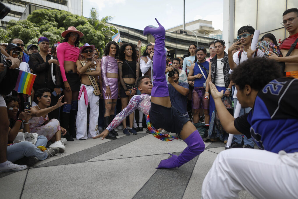 A reveler performs during a dance battle in a Gay Pride march in Caracas, Venezuela, Sunday, July 7, 2024. (AP Photo/Cristian Hernandez)