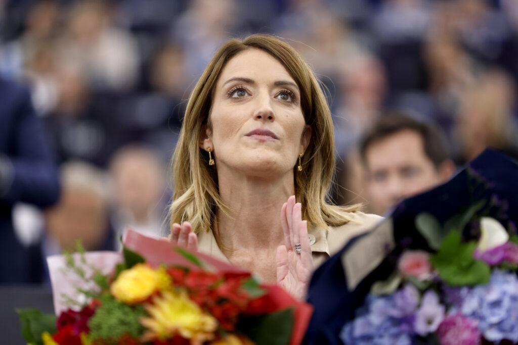 European Parliament President Roberta Metsola receives flowers during the opening session of the newly elected European Parliament in Strasbourg, eastern France, Tuesday, July 16, 2024. (AP Photo/Jean-Francois Badias)