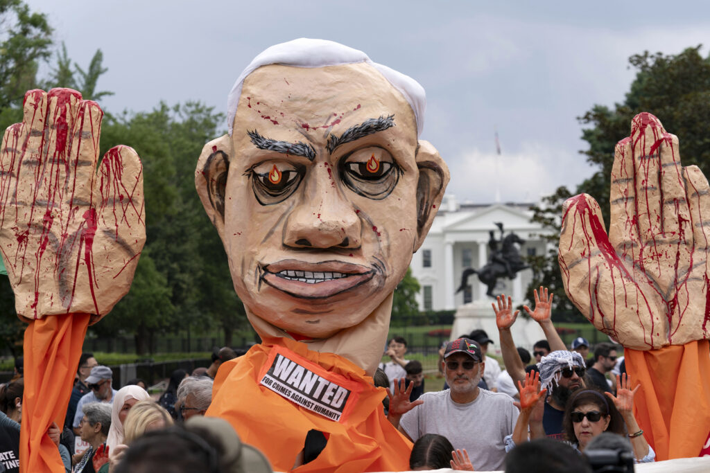 With the White House in the background, demonstrators protest the visit of Israeli Prime Minister Benjamin Netanyahu to the White House during a rally at Lafayette Park, Thursday, July 25, 2024, in Washington. (AP Photo/Jose Luis Magana)