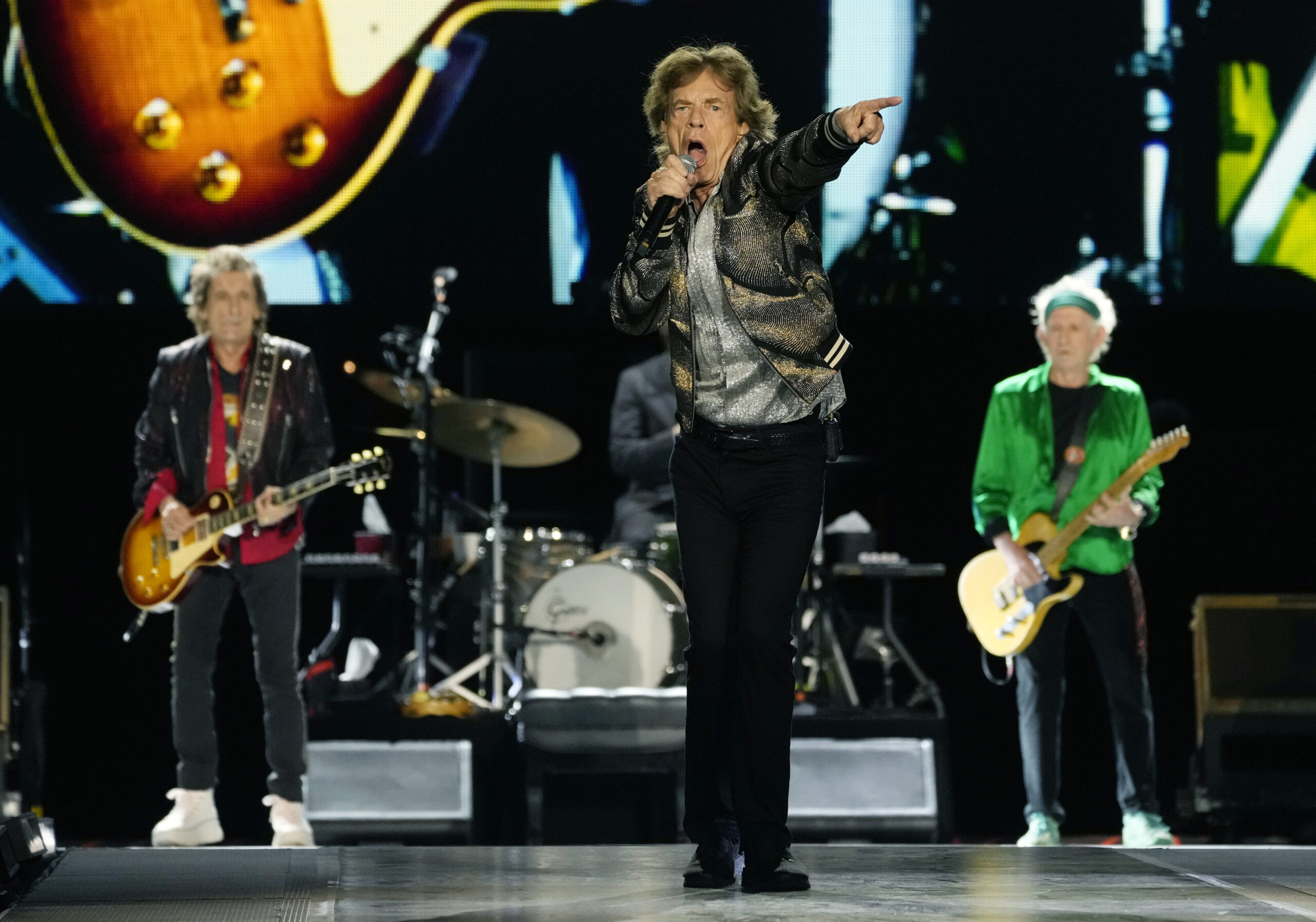 Mick Jagger, center, performs with Ron Wood, left, and Keith Richards of The Rolling Stones during their "Hackney Diamonds" tour stop at SoFi Stadium, Wednesday, July 10, 2024, in Inglewood, Calif. (AP Photo/Chris Pizzello)