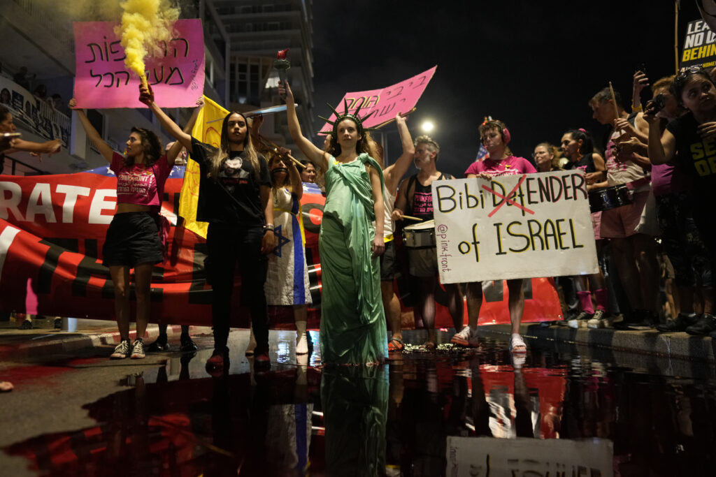 Demonstrators take part in a protest demanding a cease-fire and the release of Israeli hostages outside of the U.S. Embassy Branch Office as the Prime Minister Benjamin Netanyahu delivers his speech to Congress, Wednesday, July 24, 2024, in Tel Aviv, Israel. (AP Photo/Ohad Zwigenberg)