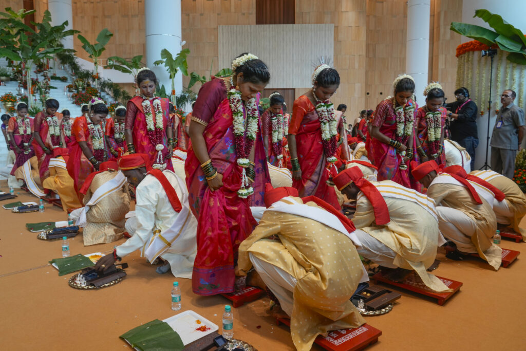 Underprivileged couples take part in a mass wedding organised by Chairman of Reliance Industries Limited Mukesh Ambani as the part of pre- wedding celebrations of his youngest son, Anant Ambani in Navi Mumbai, India, Tuesday, July 2, 2024. (AP Photo/Rafiq Maqbool)