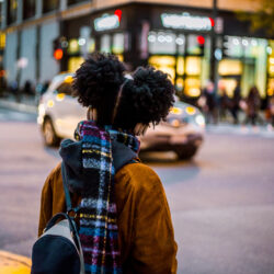 A young girl looks both ways before crossing the street. Photo: gunther/Adobe Stock