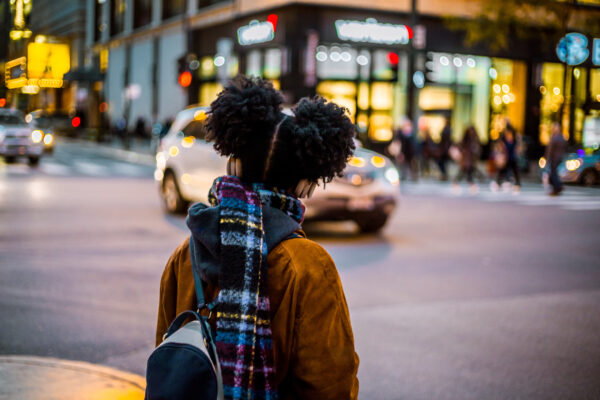 A young girl looks both ways before crossing the street. Photo: gunther/Adobe Stock