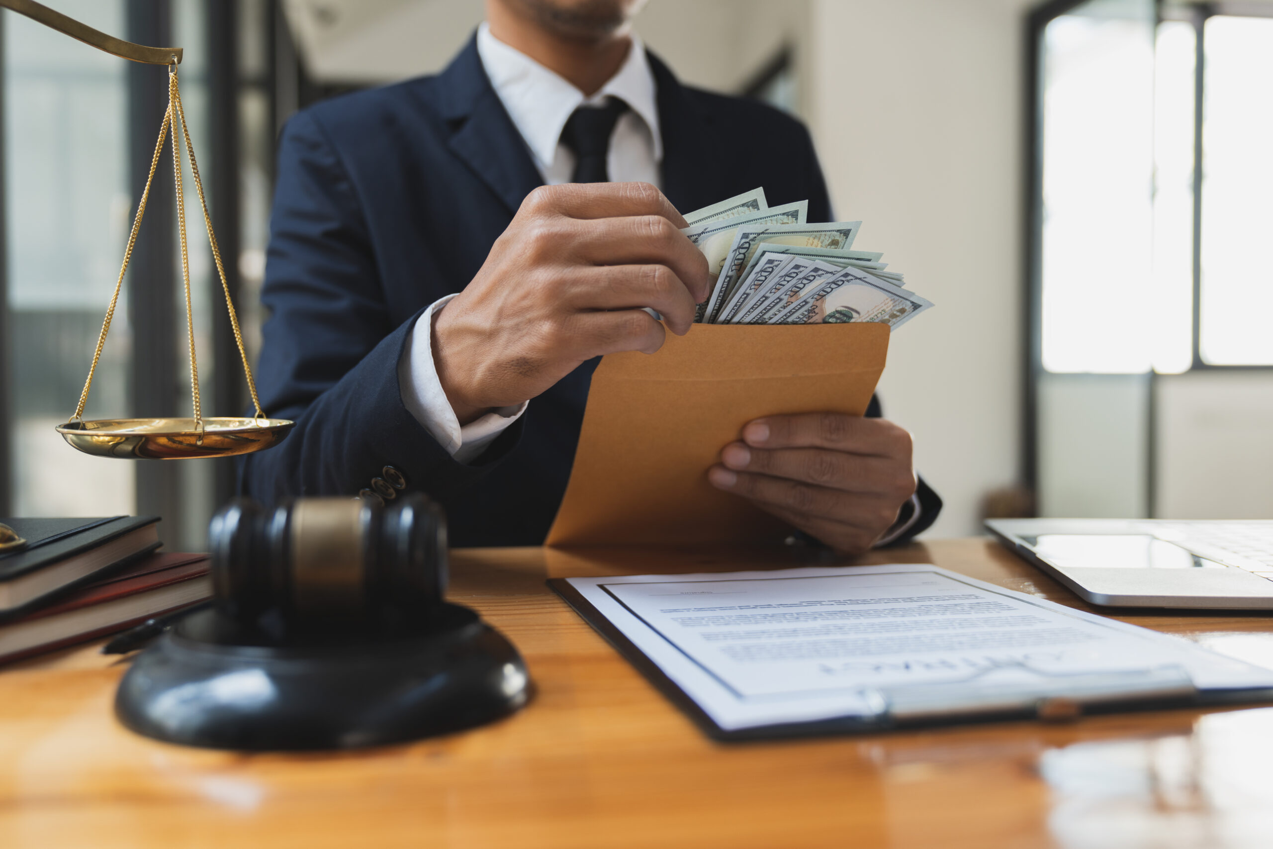 A personal injury attorney from Sheepshead Bay has been charged with embezzling approximately $253,000 from eight of his clients. Photo: Phimwilai/Adobe Stock