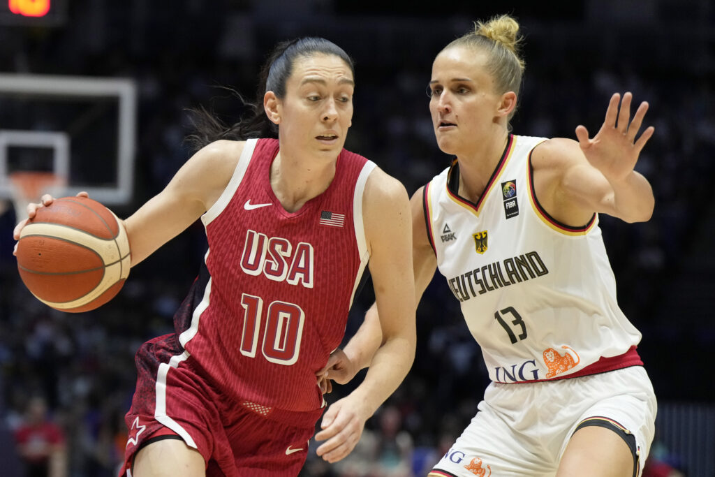 Liberty forward Breanna Stewart drives past New York teammate Leonie Fiebich during Team USA's win over Team Germany Tuesday in London. AP Photo by Alastair Grant