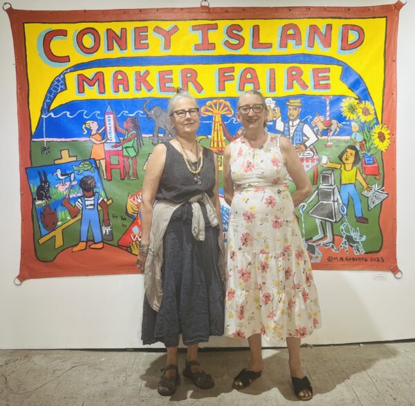 From left: Artist Marie Roberts and Alicia Degener in front of Roberts’ “Coney Island Maker Faire.” Brooklyn Eagle photo by Wayne Daren Schneiderman