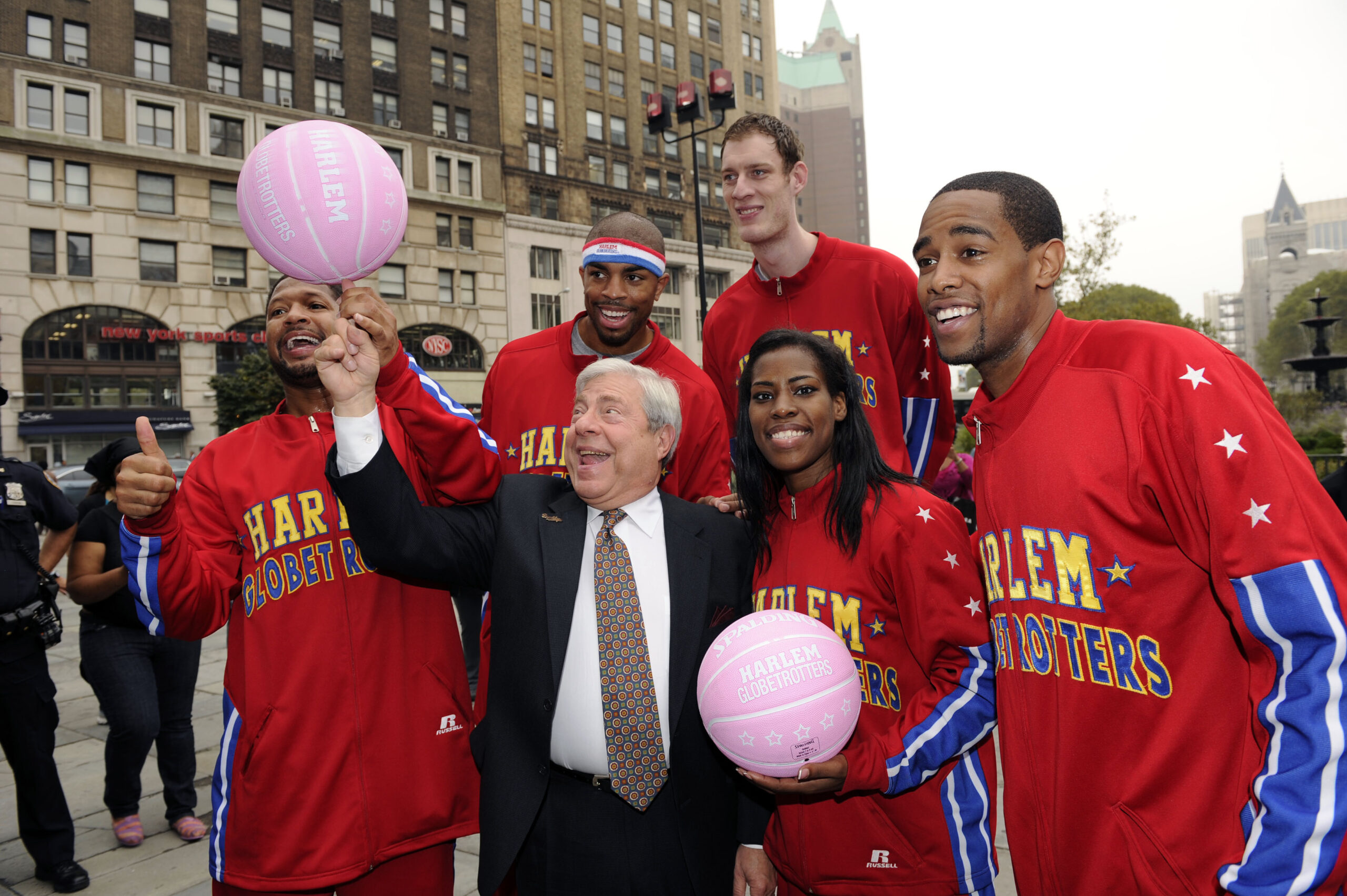 Then-Brooklyn Borough President Marty Markowitz, center and, from left, Hammer Harrison, Handles Franklin, Paul 'Tiny' Sturgess, TNT Maddox and Cheese Chisholm of the Harlem Globetrotters pose after crossing the Brooklyn Bridge using pink basketballs to show their support for National Breast Cancer Awareness on Oct. 3, 2012. Photo by Bryan Bedder/Invision for Harlem Globetrotters/AP Images