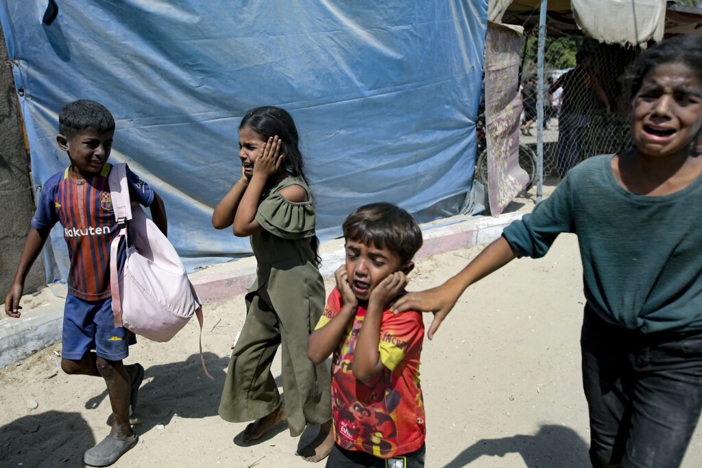 Palestinian children are evacuated from a site hit by an Israeli bombardment on Khan Younis, southern Gaza Strip, Saturday, July 13, 2024. Israel said it targeted Hamas' shadowy military commander in a massive strike Saturday in the crowded southern Gaza Strip that killed at least 71 people, according to local health officials. Hamas immediately rejected the claim that Mohammed Deif was targeted. (AP Photo/Jehad Alshrafi)