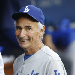 Los Angeles Dodgers Hall of Fame pitcher Sandy Koufax, on hand for the Dodgers' Old Timers Game festivities, smiles as he talks to current members of the team in the dugout before the baseball game between the Los Angeles Dodgers and Colorado Rockies, Saturday, May 16, 2015, in Los Angeles. AP Photo/Danny Moloshok, File