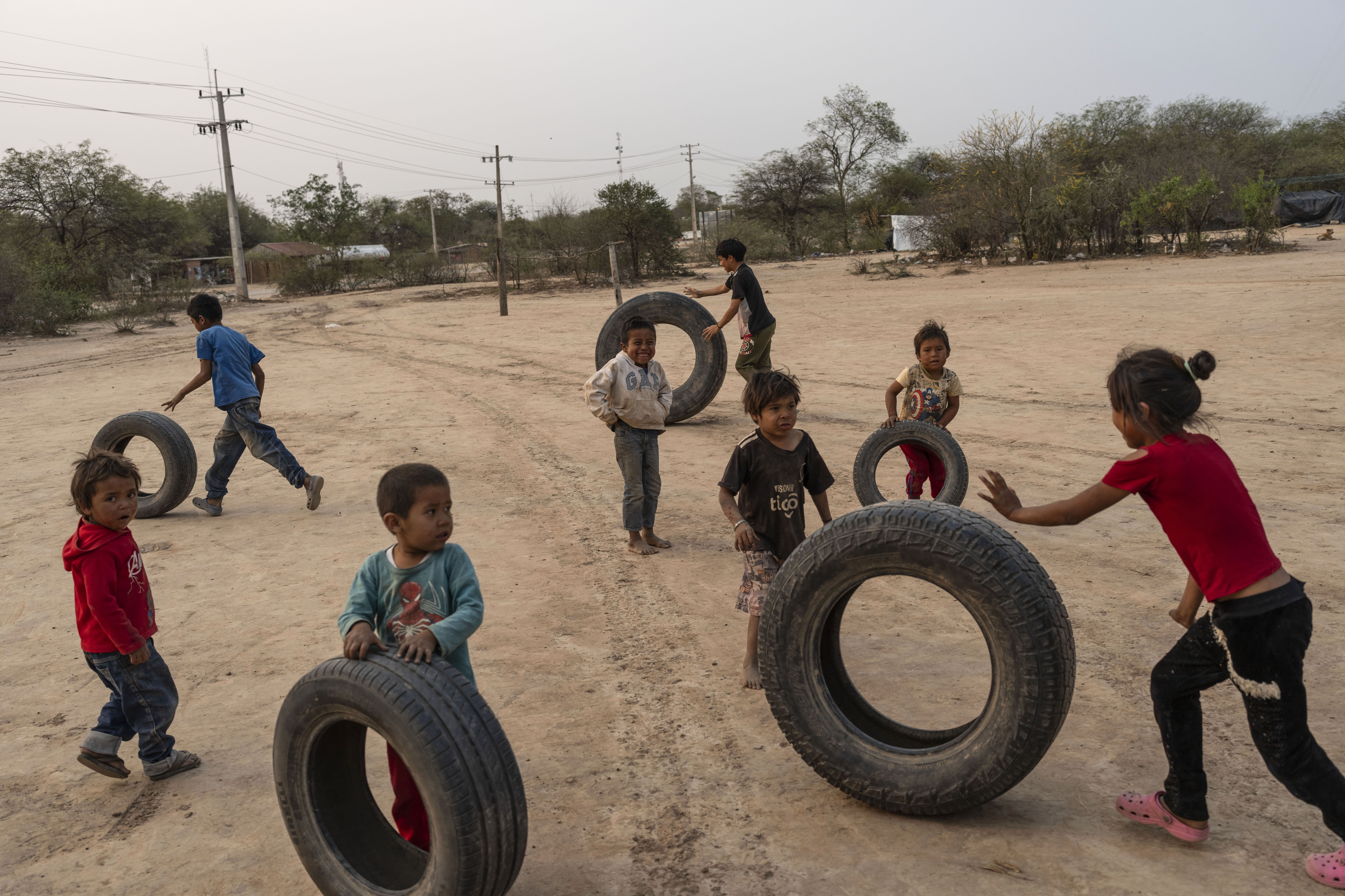 Manjui Indigenous children play in the Abisai community in Mariscal Estigarribia, in the western region of Paraguay known as the Paraguayan Chaco, Wednesday, Aug. 28, 2024. (AP Photo/Rodrigo Abd)