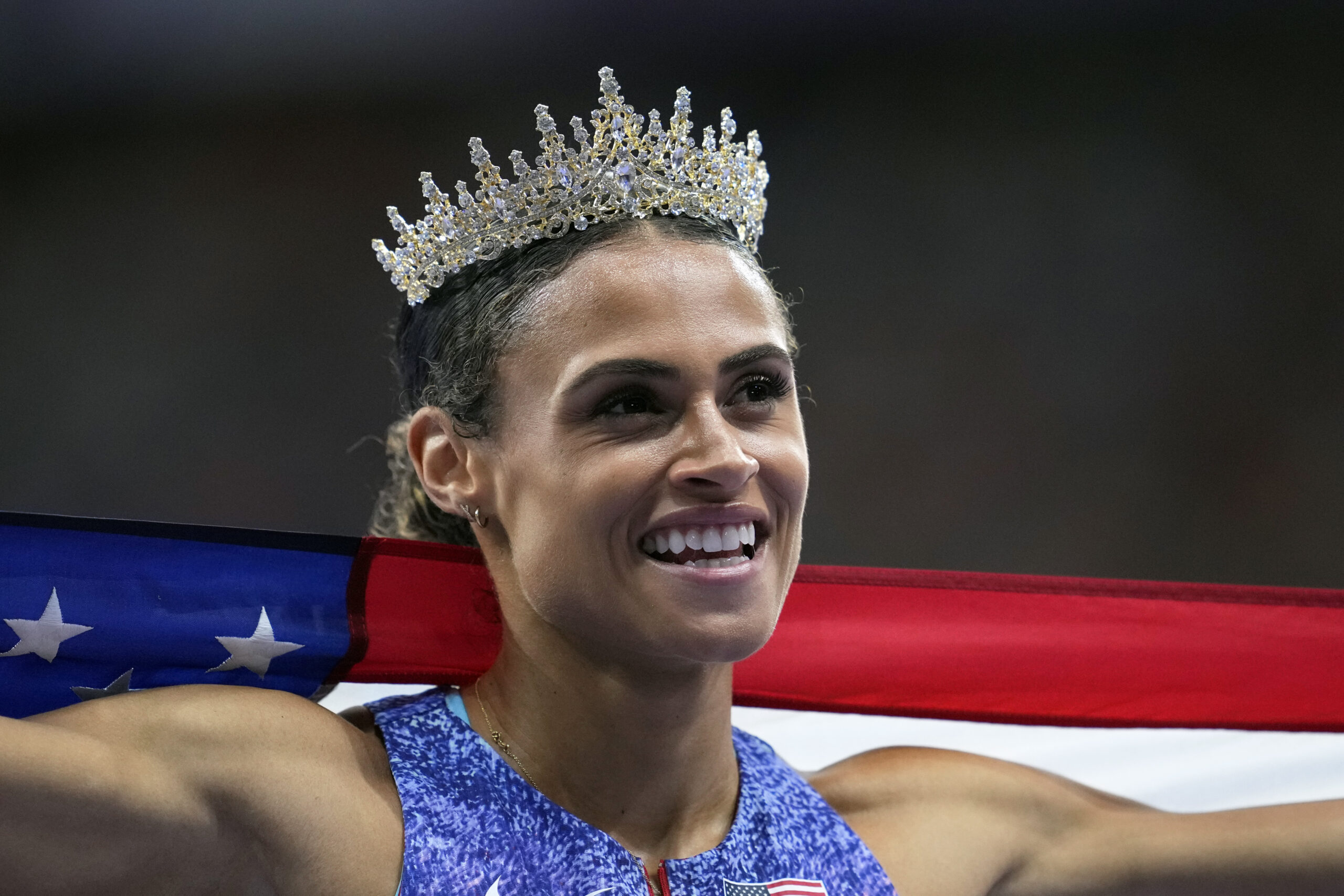 Sydney McLaughlin-Levrone, of the United States, poses after winning the gold medal in the women's 400 meters hurdles final at the 2024 Summer Olympics, Thursday, Aug. 8, 2024, in Saint-Denis, France. (AP Photo/Ashley Landis)