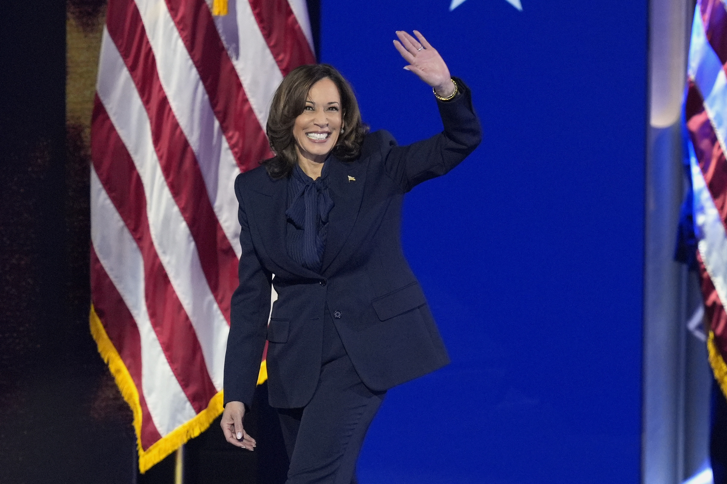 Democratic presidential nominee Vice President Kamala Harris walks on stage to speak during the Democratic National Convention Thursday, Aug. 22, 2024, in Chicago. (AP Photo/J. Scott Applewhite)