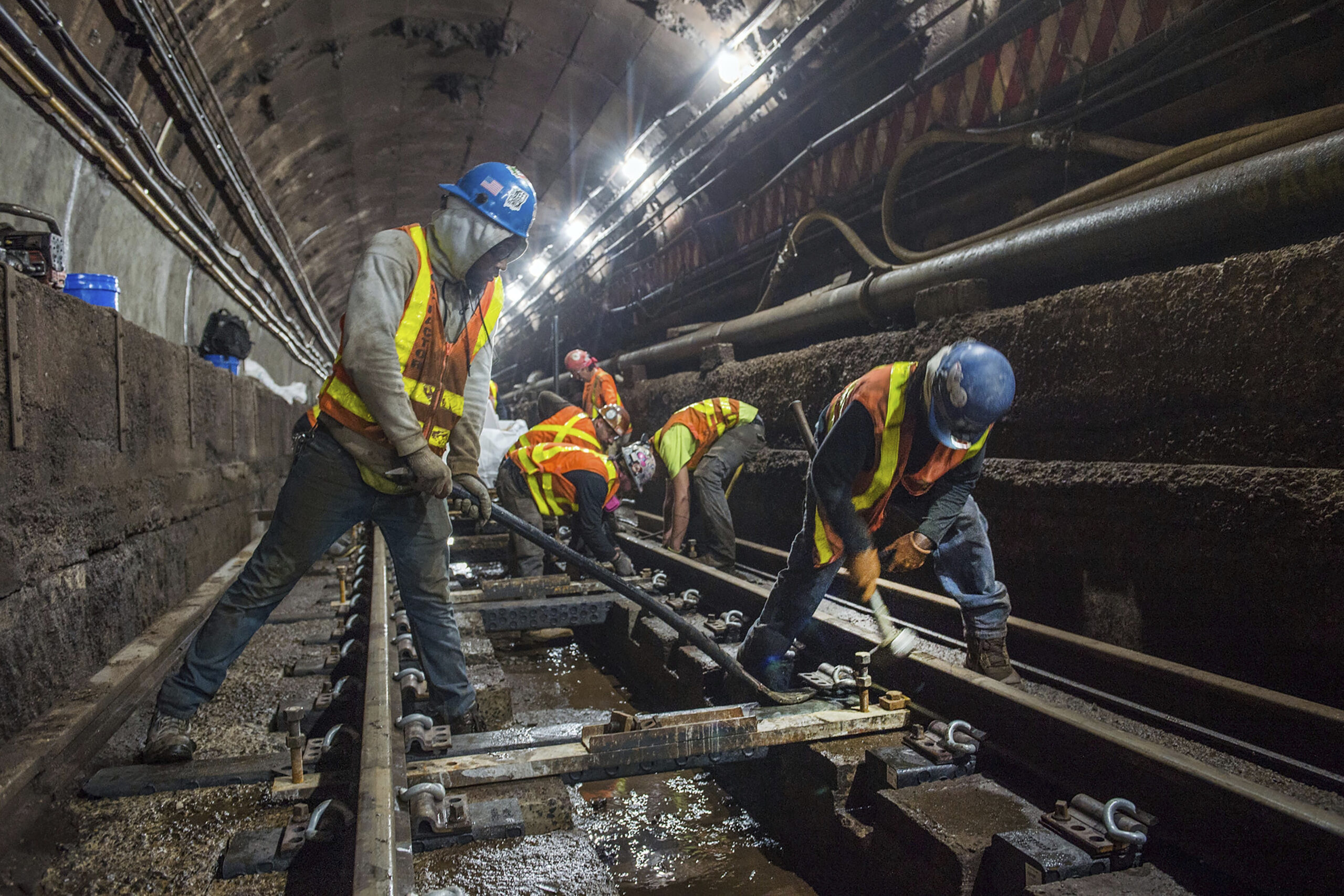 This photo provided by the Metropolitan Transportation Authority, June 15, 2019, shows workers during the L Project subway tunnel rehabilitation, in New York. Trent Reeves/Metropolitan Transportation Authority via AP, File