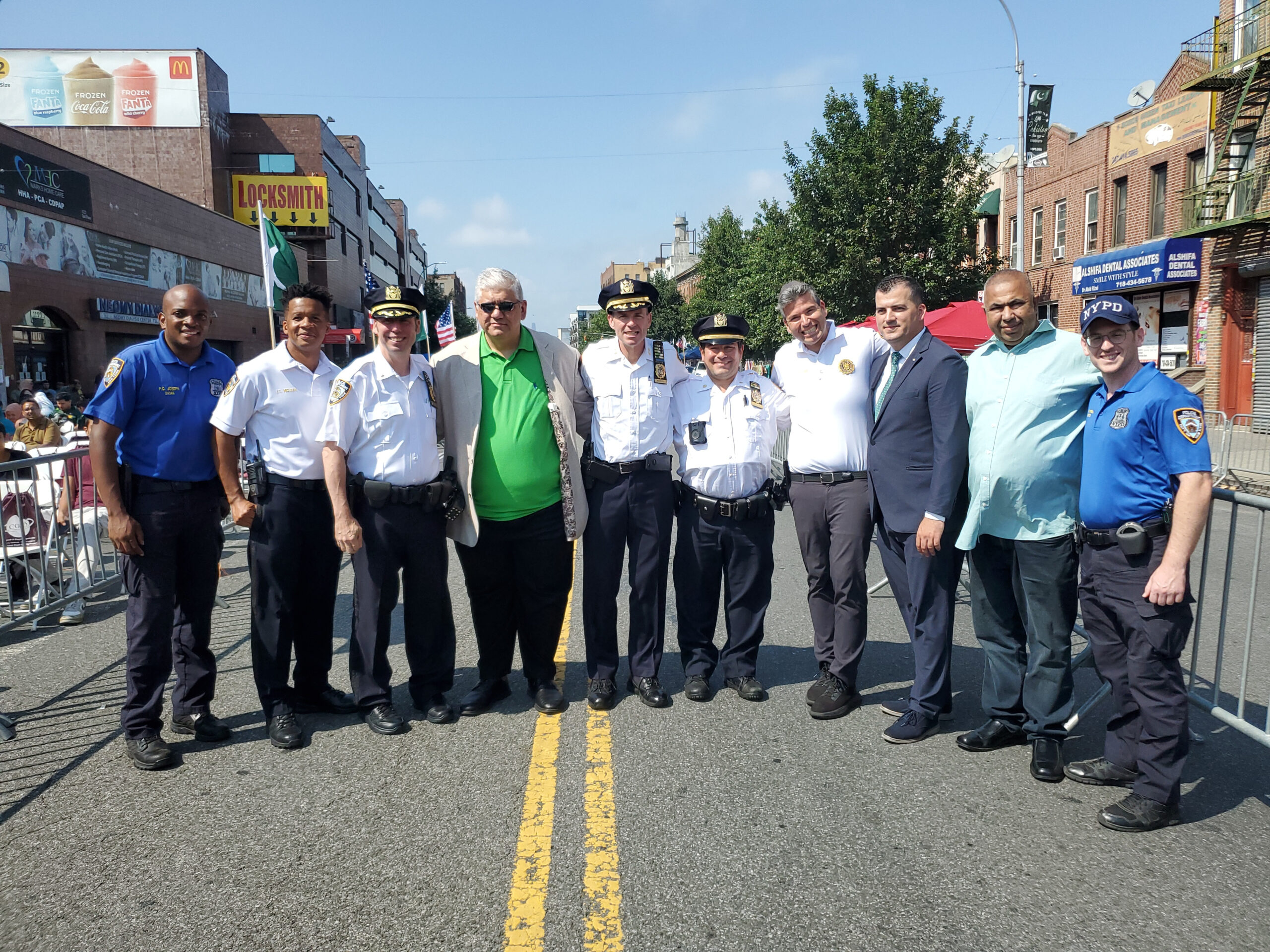 Richie Barsamian and Marko Kepi alongside officers of Brooklyn South and the 70th Precinct.