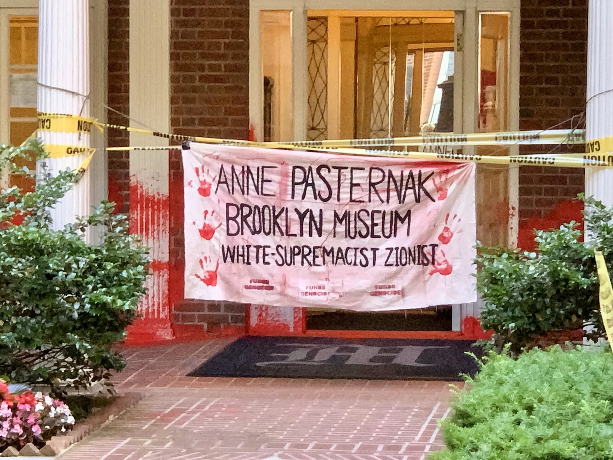 Police have arrested one of six suspects wanted for the hate-crime vandalism of the homes of Brooklyn Museum executives, including this Brooklyn Heights building. Photo Mary Frost