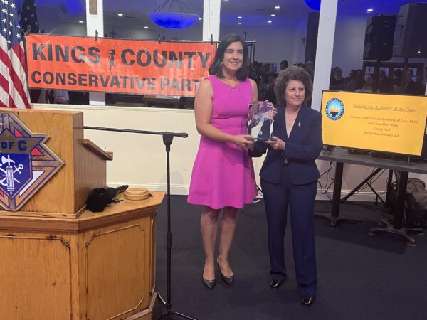 From left: Congressmember Nicole Malliotakis being presented with the Kings County Conservative Party’s American Heritage award by Fran Vella-Marrone. Brooklyn Eagle photo by Wayne Daren Schneiderman