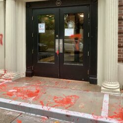 The columns, sidewalk and vestibule of this Orange Street co-op were defaced by pro-Palestinian vandals Thursday. Photo by Mary Frost