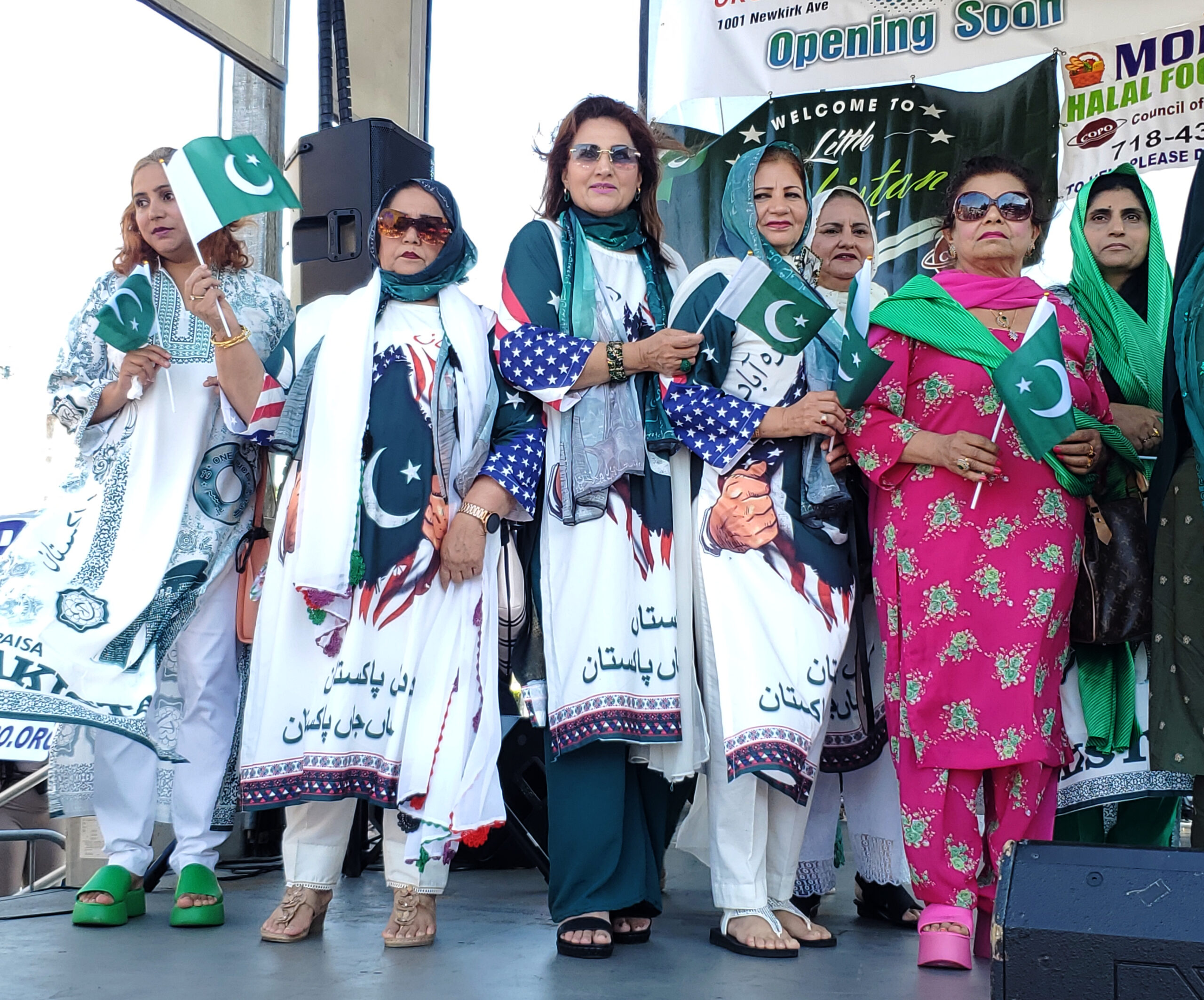 Pakistani women holding their flags with pride.