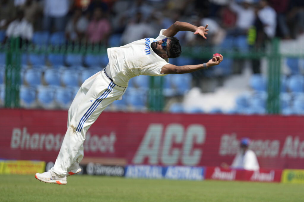 India's Mohammed Siraj takes the catch to get the wicket of Bangladesh's Shakib Al Hasan on the fourth day of the second cricket test match between Bangladesh and India in Kanpur, India, Monday, Sept. 30, 2024. (AP Photo/Ajit Solanki)