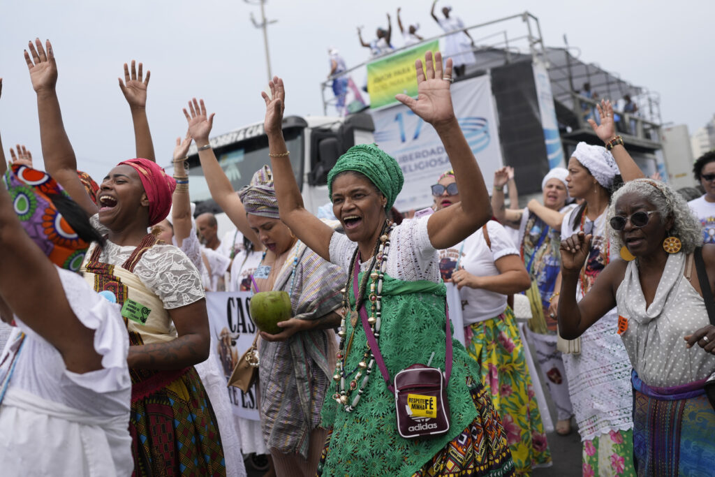 Faithful from various religions participate in the Defense of Religious Freedom march at Copacabana beach in Rio de Janeiro, Sunday, Sept. 15, 2024. The march seeks to bring attention to religious intolerance in the country. (AP Photo/Silvia Izquierdo)