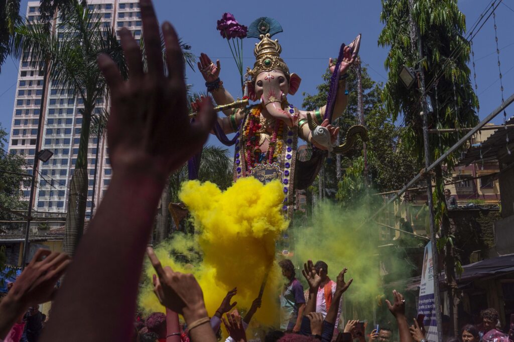 An idol of elephant-headed Hindu god Ganesha is taken for immersion on the final day of the ten-day long Ganesh Chaturthi festival in Mumbai, India, Tuesday, Sept. 17, 2024. (AP Photo/Rafiq Maqbool)